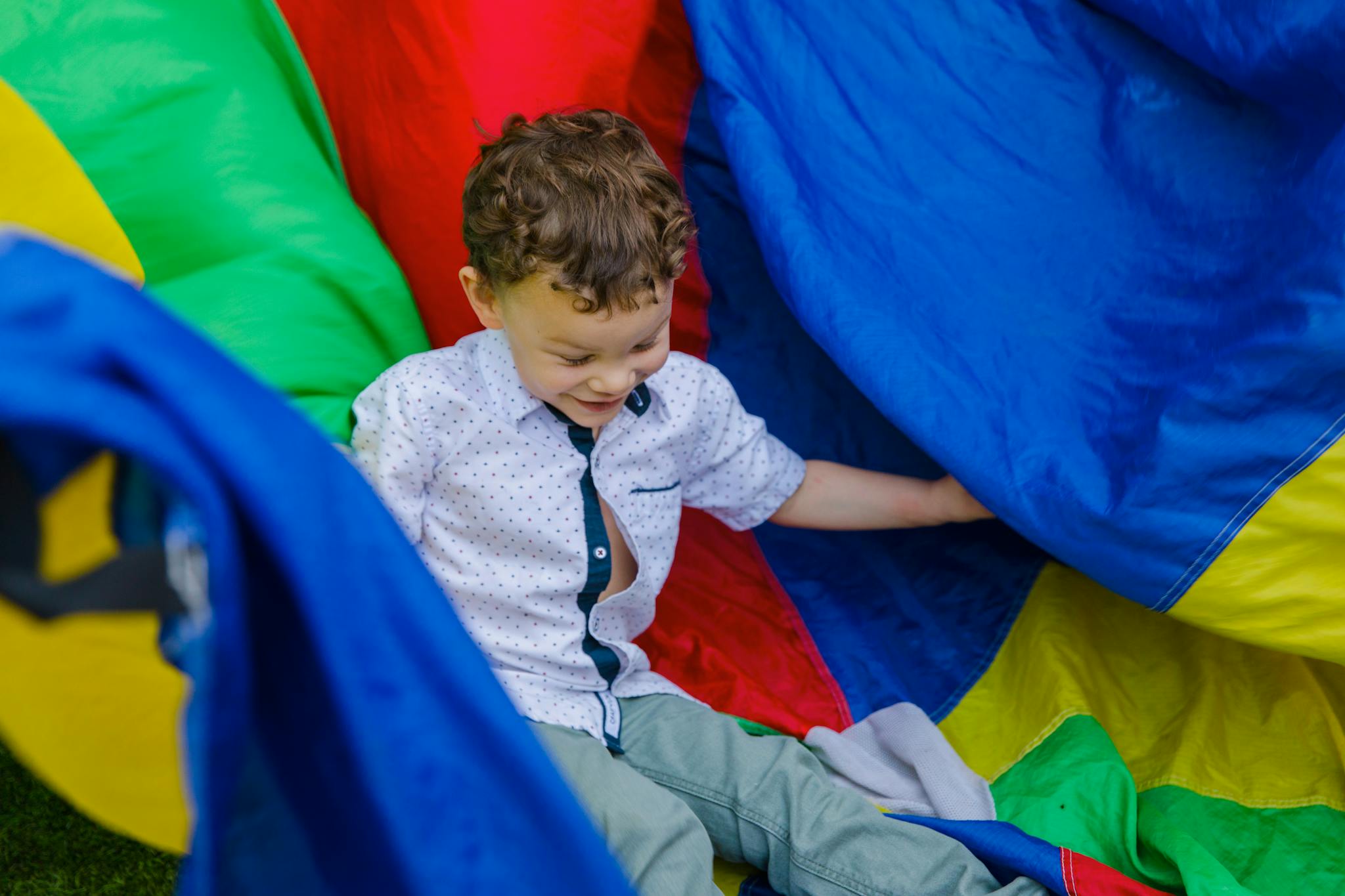 A happy child enjoying playtime outdoors with vibrant colors and fun activities.